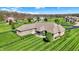Aerial view of a brick home featuring a manicured lawn, screened porch, and mature landscaping at 6829 Whitetail Woods Ct, Bargersville, IN 46106