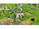 An aerial view of a home highlighting its manicured lawn and circular driveway at 6829 Whitetail Woods Ct, Bargersville, IN 46106
