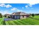 Aerial view of a well-maintained property featuring a large, attached garage and fenced backyard at 6829 Whitetail Woods Ct, Bargersville, IN 46106