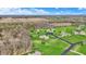 Aerial shot capturing several homes with lush green lawns, mature trees, and curving driveways at 6829 Whitetail Woods Ct, Bargersville, IN 46106