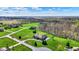 Sprawling one-story home with lush green lawns and mature trees in a scenic setting at 6829 Whitetail Woods Ct, Bargersville, IN 46106