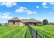 Expansive backyard featuring manicured lawn and fence at 6829 Whitetail Woods Ct, Bargersville, IN 46106