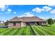 Aerial view showcasing a spacious backyard, brick exterior, and well-maintained landscaping at 6829 Whitetail Woods Ct, Bargersville, IN 46106