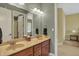 Bathroom featuring double vanity sink, and a large mirror at 6829 Whitetail Woods Ct, Bargersville, IN 46106