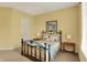 Cozy bedroom features a wrought iron bed frame, neutral walls, and side tables with lamps at 6829 Whitetail Woods Ct, Bargersville, IN 46106