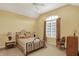 Bedroom with vaulted ceilings, neutral carpet, large window, and furnishings at 6829 Whitetail Woods Ct, Bargersville, IN 46106