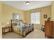 Bedroom with light neutral walls, furnishings, and large window at 6829 Whitetail Woods Ct, Bargersville, IN 46106
