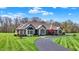 Charming one-story home features manicured lawn, brick accents, and a welcoming driveway at 6829 Whitetail Woods Ct, Bargersville, IN 46106