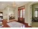 Elegant foyer featuring hardwood floors and a view to the formal dining room at 6829 Whitetail Woods Ct, Bargersville, IN 46106