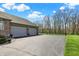 Three car garage and wide driveway at 6829 Whitetail Woods Ct, Bargersville, IN 46106