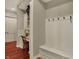 Hallway nook features a built-in desk and bench with coat hooks at 6829 Whitetail Woods Ct, Bargersville, IN 46106