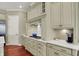 Well-appointed kitchen featuring custom cabinets, granite countertops, and modern gas stovetop at 6829 Whitetail Woods Ct, Bargersville, IN 46106
