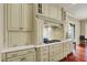 This stylish kitchen features custom cabinets, granite countertops, and a modern gas stovetop at 6829 Whitetail Woods Ct, Bargersville, IN 46106