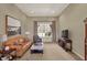 Comfortable living room featuring a leather sofa and large picture window at 6829 Whitetail Woods Ct, Bargersville, IN 46106