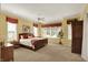 Sun-filled main bedroom with ample natural light and ceiling fan at 6829 Whitetail Woods Ct, Bargersville, IN 46106