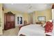 Large primary bedroom with an armoire and access to the backyard at 6829 Whitetail Woods Ct, Bargersville, IN 46106