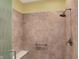 Tiled walk-in shower featuring a bench and a handrail at 6829 Whitetail Woods Ct, Bargersville, IN 46106