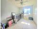 Bright bedroom featuring a ceiling fan, window, and neutral decor at 7108 Hearthstone Way, Indianapolis, IN 46227