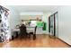 Comfortable dining area with hardwood floors and view to the kitchen and laundry room, creating a perfect space at 7108 Hearthstone Way, Indianapolis, IN 46227