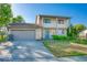 Charming two-story home featuring stone accents, a covered porch, an attached garage, and a well-maintained front yard at 7108 Hearthstone Way, Indianapolis, IN 46227
