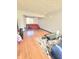 Bright living room with wood floors, a large window, and ample space for comfortable seating at 7108 Hearthstone Way, Indianapolis, IN 46227
