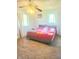 Bright main bedroom with neutral walls, carpet flooring, and two windows providing plenty of natural light at 7108 Hearthstone Way, Indianapolis, IN 46227