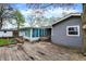 Wooden deck with access to the sunroom and the house at 7212 E Pleasant Run Pkwy S Dr, Indianapolis, IN 46219