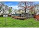 Well-maintained backyard with a wooden deck attached to the house at 7212 E Pleasant Run Pkwy S Dr, Indianapolis, IN 46219