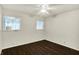 Bright bedroom with ceiling fan, and nice dark wood floors at 7212 E Pleasant Run Pkwy S Dr, Indianapolis, IN 46219