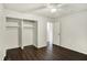 Bedroom with large closet and ceiling fan, with lots of natural light at 7212 E Pleasant Run Pkwy S Dr, Indianapolis, IN 46219