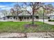 Charming one-story home featuring a well-maintained lawn and a classic ranch-style facade at 7212 E Pleasant Run Pkwy S Dr, Indianapolis, IN 46219