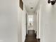 Hallway leading to bathroom with decorative horse at 7212 E Pleasant Run Pkwy S Dr, Indianapolis, IN 46219