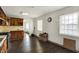 Eat-in kitchen featuring oak cabinets, stainless steel appliances, and tile countertops at 7212 E Pleasant Run Pkwy S Dr, Indianapolis, IN 46219