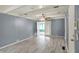 Spacious living room boasts a ceiling fan, wood floors, and ample natural light at 7212 E Pleasant Run Pkwy S Dr, Indianapolis, IN 46219