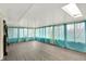 Sunroom with wood floors, lots of windows, and lots of natural light at 7212 E Pleasant Run Pkwy S Dr, Indianapolis, IN 46219