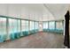 Sunroom boasts wood floors, bright windows, and a skylight at 7212 E Pleasant Run Pkwy S Dr, Indianapolis, IN 46219