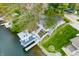 Birds-eye view of home featuring a dock with furniture and a boat lift on the water at 7456 Heather Ct, Nineveh, IN 46164