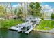 Aerial view of home featuring a white deck with a boat lift on the water at 7456 Heather Ct, Nineveh, IN 46164