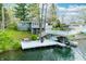Aerial view of home featuring a white deck with a boat lift and a basketball hoop at 7456 Heather Ct, Nineveh, IN 46164