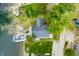 Aerial view of home featuring a boat dock with outdoor seating and a boat lift on the water at 7456 Heather Ct, Nineveh, IN 46164