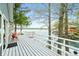 Lake home with a spacious back deck, white railing, and views of the lake at 7456 Heather Ct, Nineveh, IN 46164