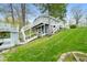 Lakeside house with multiple decks, waterfront access and well-kept grassy area at 7456 Heather Ct, Nineveh, IN 46164