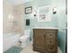 Bathroom featuring a tiled shower, toilet, vanity, and modern fixtures, with blue wall details at 7456 Heather Ct, Nineveh, IN 46164