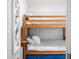 Cozy bedroom featuring wooden bunk beds and white paneled walls at 7456 Heather Ct, Nineveh, IN 46164