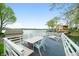 Waterfront deck featuring lounge chairs, dining area and beautiful lake views at 7456 Heather Ct, Nineveh, IN 46164