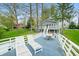 Deck area featuring outdoor table, lounge chairs and lush grassy lawn at 7456 Heather Ct, Nineveh, IN 46164
