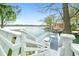 Waterfront deck featuring outdoor table, lounge chair and lake views at 7456 Heather Ct, Nineveh, IN 46164
