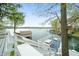 Waterfront deck featuring outdoor table, lounge chair and lake views at 7456 Heather Ct, Nineveh, IN 46164