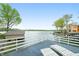 Waterfront deck featuring lounge chairs and beautiful lake views at 7456 Heather Ct, Nineveh, IN 46164