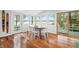 Light-filled dining room with hardwood floors offers a scenic view of the water and nature, creating an inviting space at 7456 Heather Ct, Nineveh, IN 46164